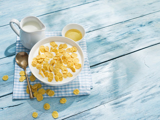 Cornflakes cereal and milk.