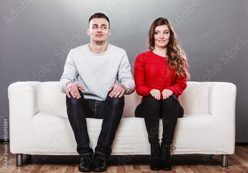 Fotografie, Obraz Shy woman and man sitting on sofa. First date.