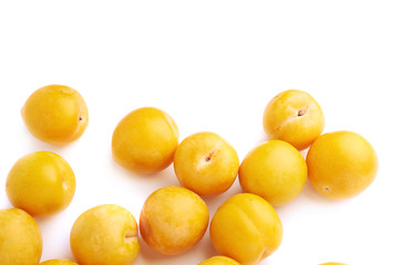 Wall Mural - Pile of multiple yellow plums isolated