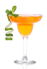 Wall Mural - Orange Margarita cocktail with mint and lime spiral in chilled s