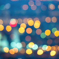 Wall Mural - abstract blue circular bokeh background, city lights with horizo