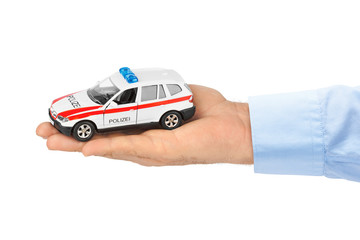 Wall Mural - Hand with toy police car