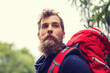 © Syda Productions - man with beard and backpack hiking