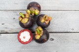 Fresh mangosteen on a wooden table