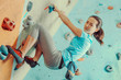 Woman training in climbing gym