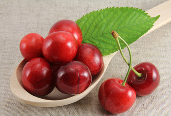 Abstract view cherry in a wooden spoon