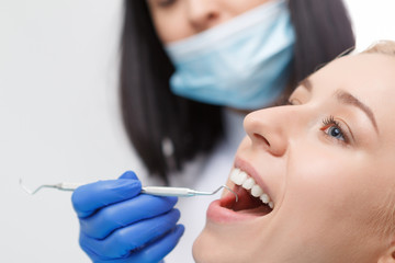 Wall Mural - Pretty blond woman during her dentist visit 