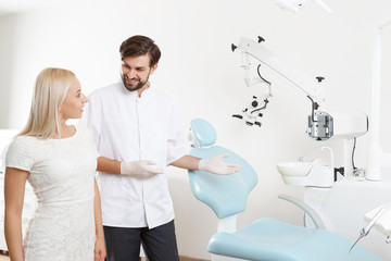 Wall Mural - Dentist showing to client working place