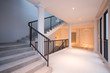 Stone staircase with black iron handrails