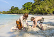 © travelview - boys are playing at the  beach with sand and building figures
