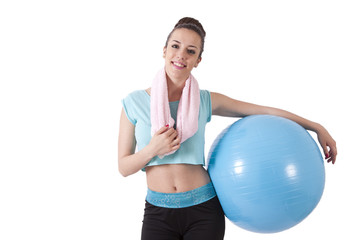 girl in the gym with ball and towel