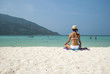 Beach meditation. Woman meditating on beach sitting in lotus pose