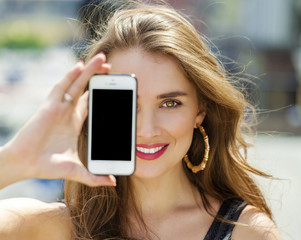 Poster - Young blonde woman covers her face screen smartphone