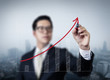 © DN6 - Businessman hand drawing graph of growth, new business in the ci