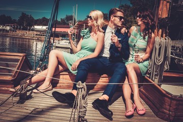 Wall Mural - Stylish wealthy friends having fun on a luxury yacht