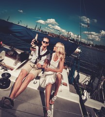 Wall Mural - Stylish wealthy couple on a yacht