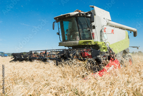 Stampe combine harvester agriculture machine harvesting golden ripe wheat field
