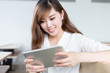 © zhu difeng - Asian beautiful female student study with tablet in classroom