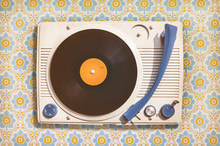 Vintage Record Player On Top Of Flower Wallpaper
