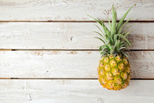 Summer Background With Pineapple On Wooden Board