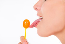 Closeup Photo Of Girl Licking A Lollipop
