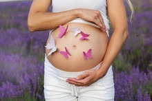 Pretty Pregnant Woman With Butterflies On Her Belly