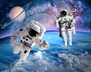 astronaut spaceman outer space saturn planet earth universe. elements of this image furnished by nas