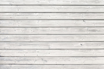 Old wooden board with nails in white