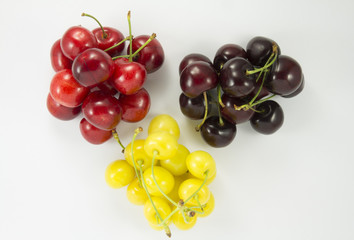 Wall Mural - Colored handfuls of cherries (sweet cherry)