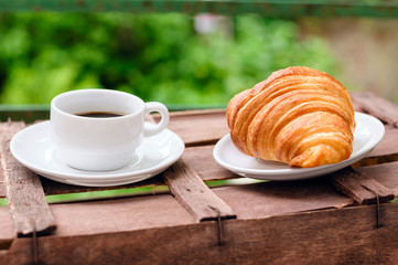 Wall Mural - cup of coffee with croissant