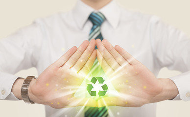 Wall Mural - Hands creating a form with recycling sign