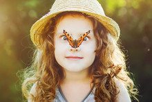 Surprised Girl With A Butterfly On Her Nose. Toning To Instagram