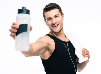 Wall Mural - Smiling fitness man holding towel and bottle with water