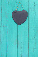 Wall Mural - Blank slate heart hanging on antique teal blue door