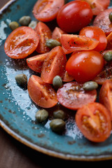 Sticker - Close-up of cherry tomatoes with capers, salt and black pepper