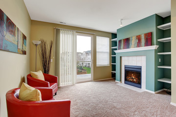 Nice living room with carpet, and fireplace.