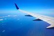 Airplane wing with blue sky