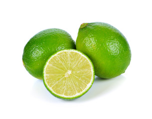 Wall Mural - Limes with half isolated on white background