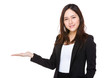 © leungchopan - Young businesswoman with open hand palm
