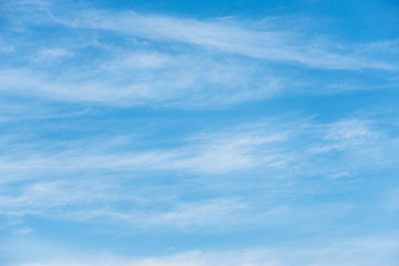 Wall Mural - Blue sky background with soft white clouds