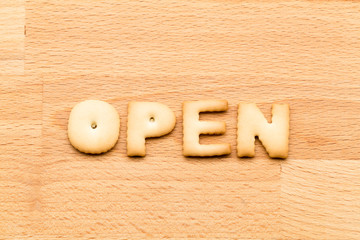 Wall Mural - Word open cookie over the wooden background