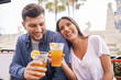 © Joshua Resnick - romantic hispanic couple drinking beer in outdoor pub