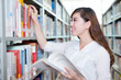 © zhu difeng - asian beautiful female student portrait in library