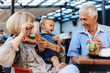© Dangubic - Grandparents With Their Grandson At Cafe