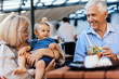 © Dangubic - Grandparents With Their Grandson At Cafe