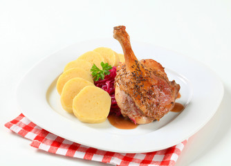 Canvas Print - Roast duck with potato dumplings and red cabbage