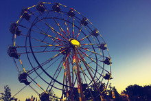 Carnival Ferris Wheel During A Beautiful Summer Sunset