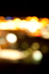 Wall Mural - golden bright lights on dark night background