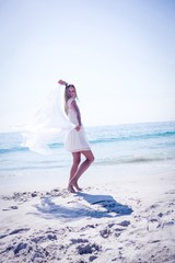 Wall Mural - Happy woman having fun at the beach 