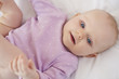 © gpointstudio - Cute newborn lying down on the bed